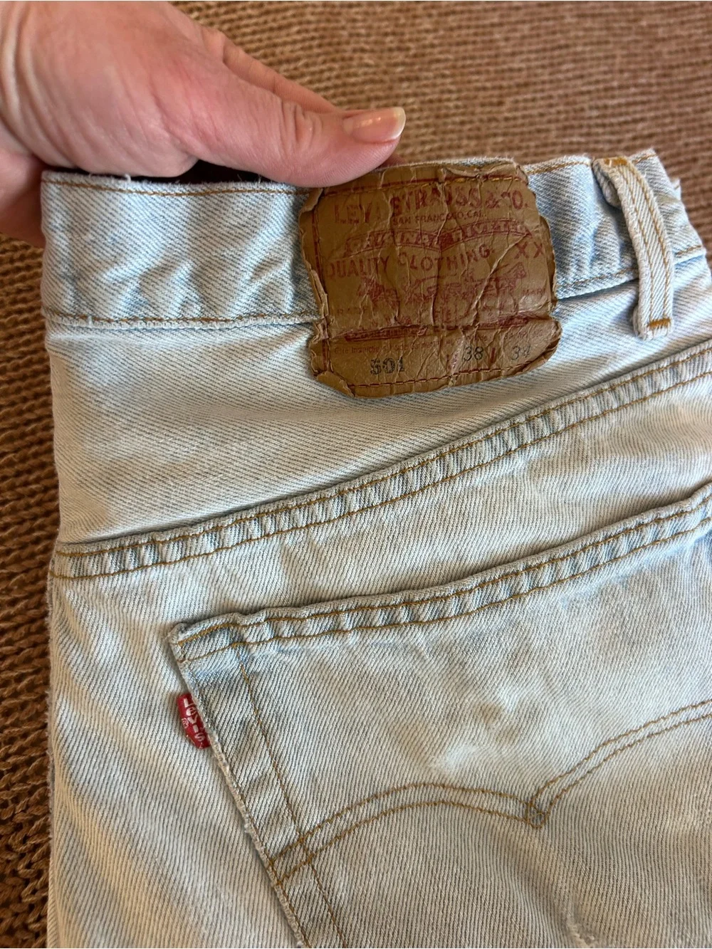 Vintage 1993 men's Levi's 501 light blue denim jeans with leather patch 38×34